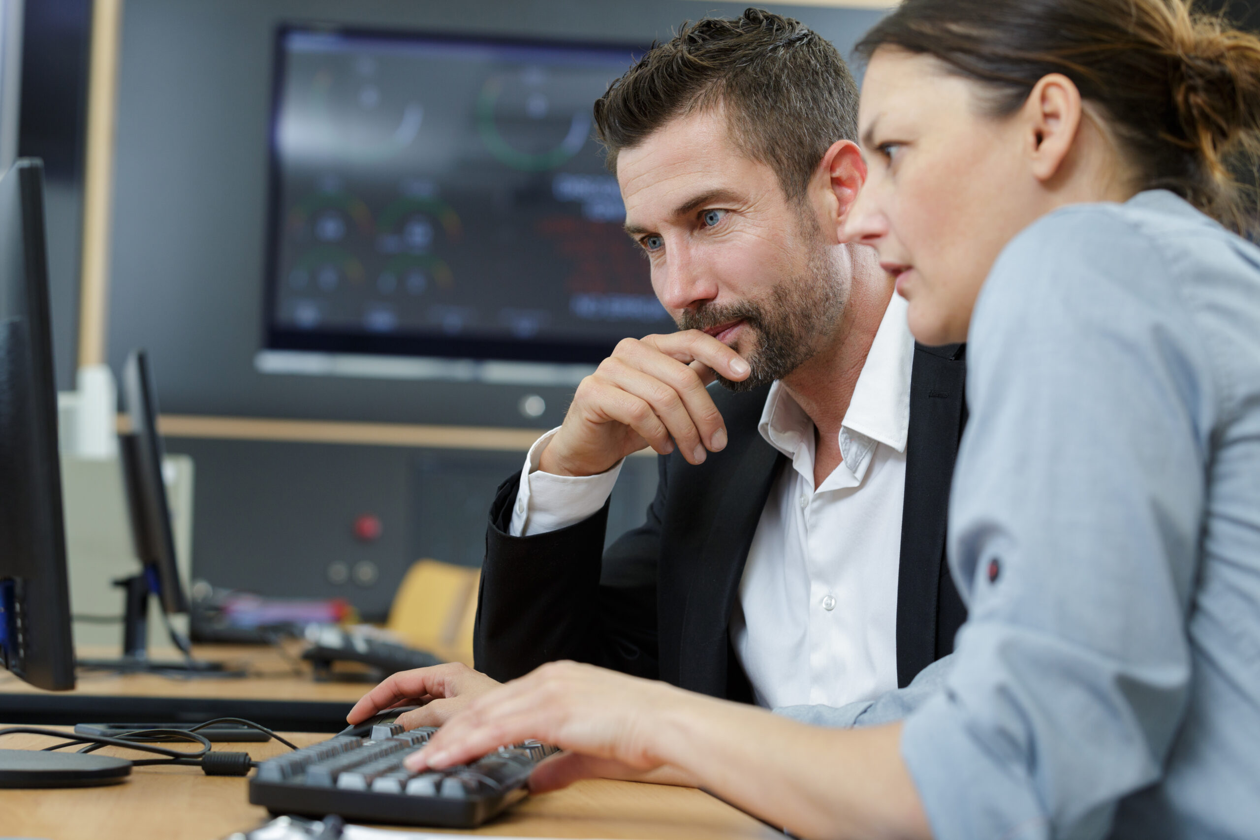 Law enforcement officers at a real-time crime center